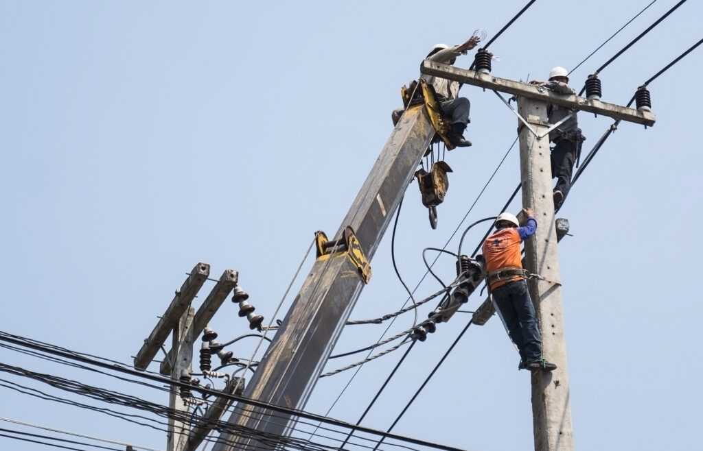 Lineman working on a utility pole from a bucket