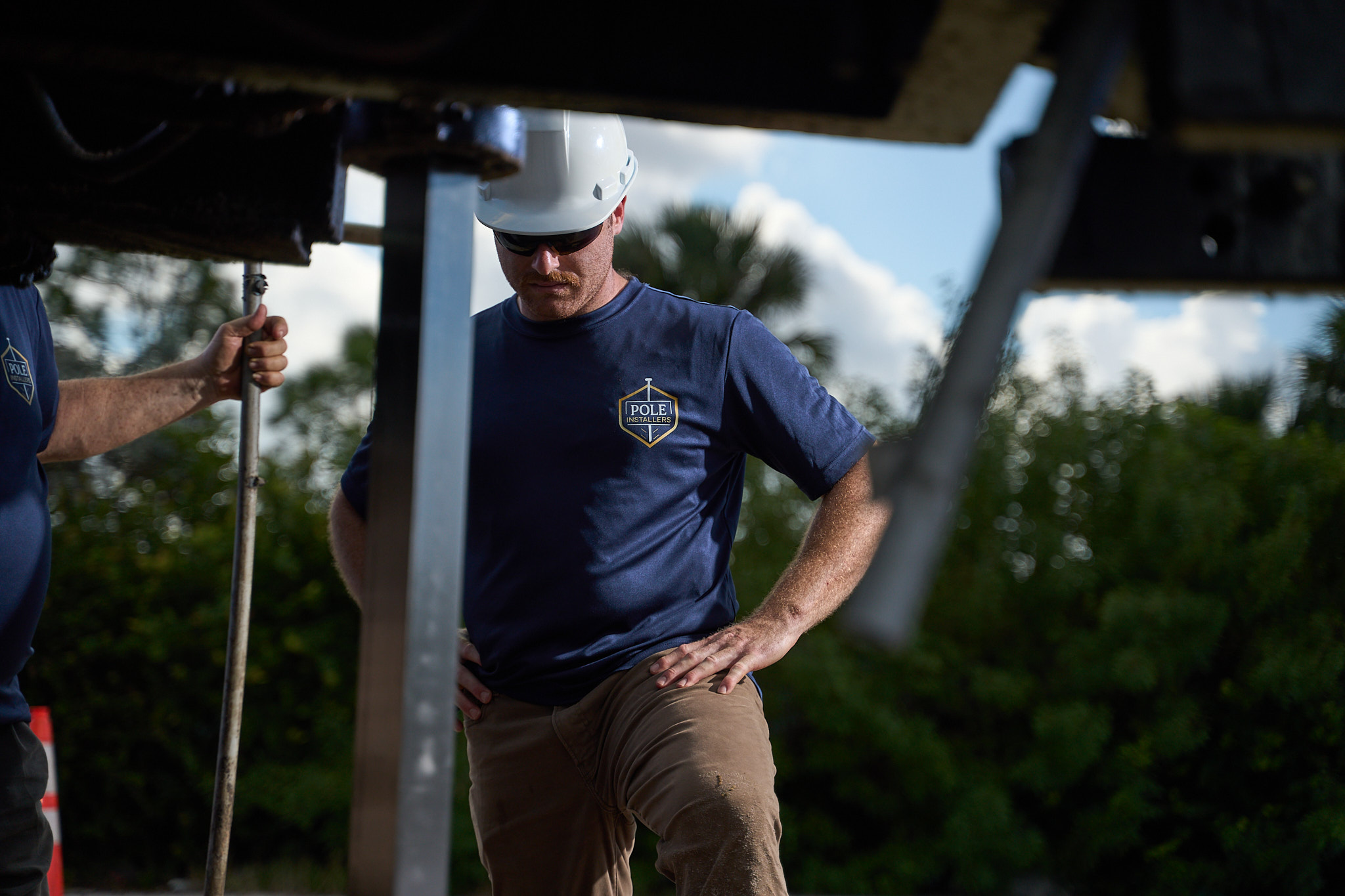 sign pole installation expert at work