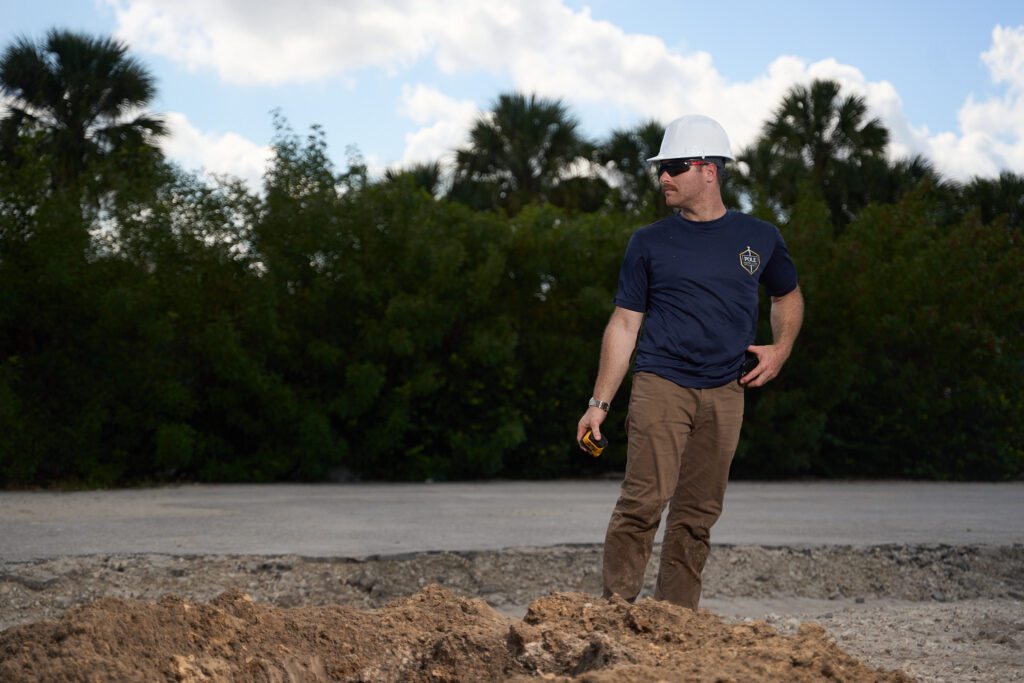 Pole Installers crew member on a commercial job site